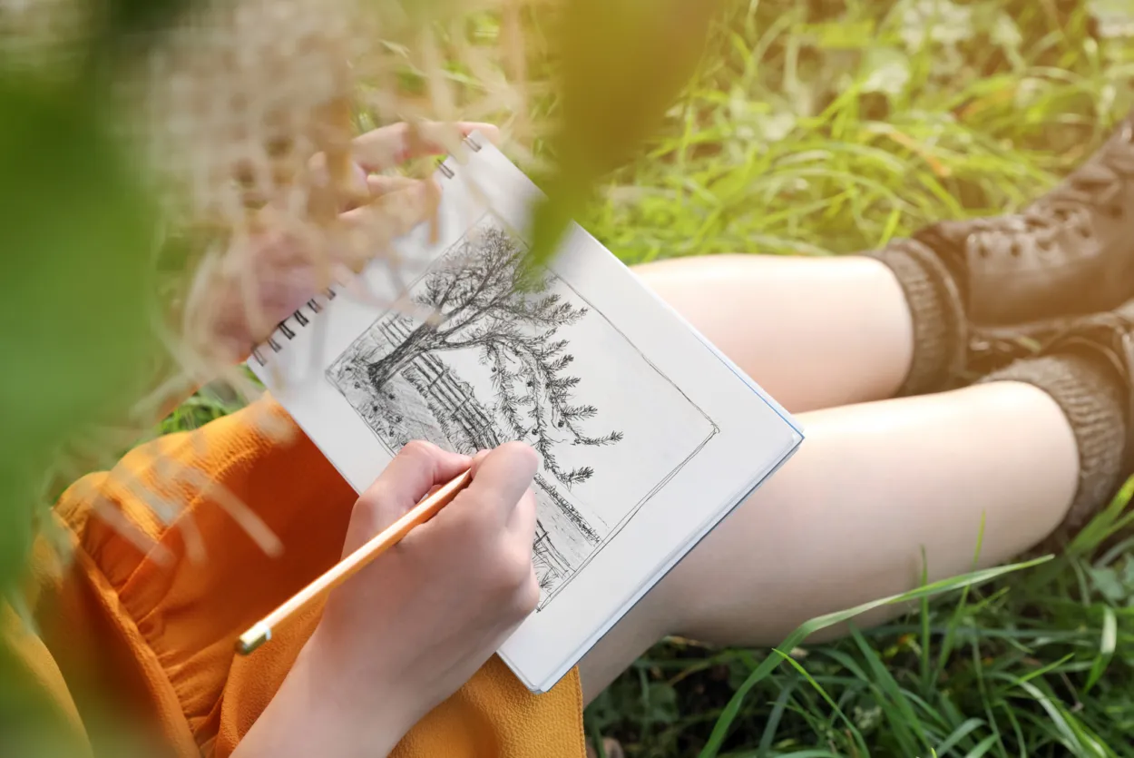 Person drawing a tree
