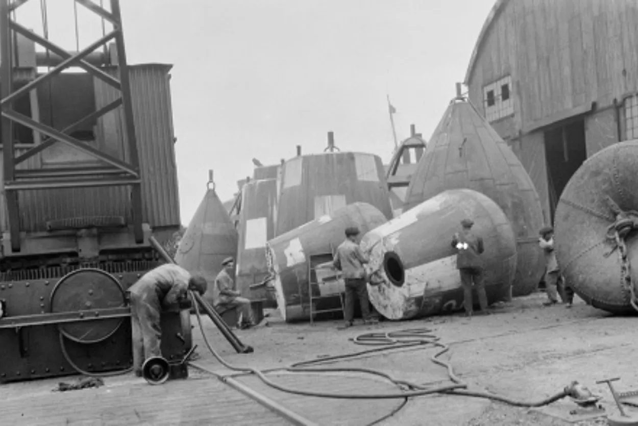 People working on Buoys at wharf