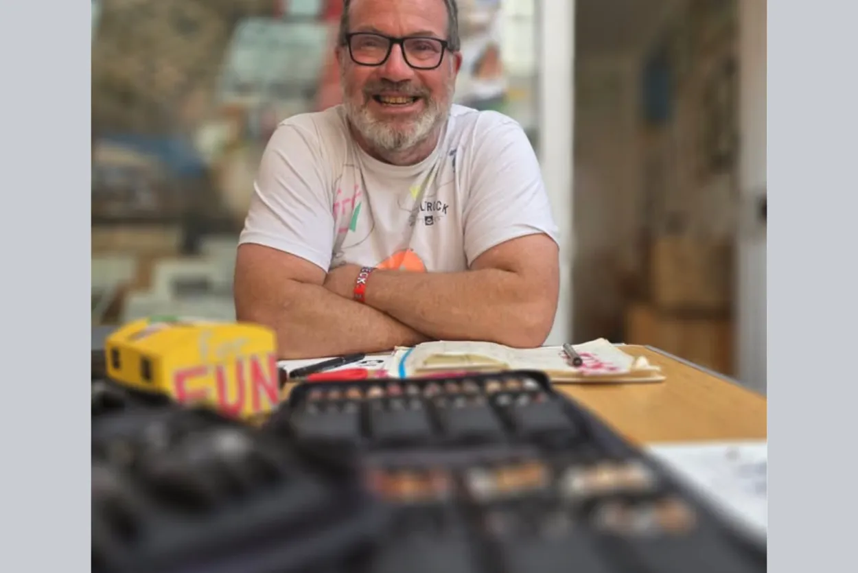 Smiling artist with pen sets