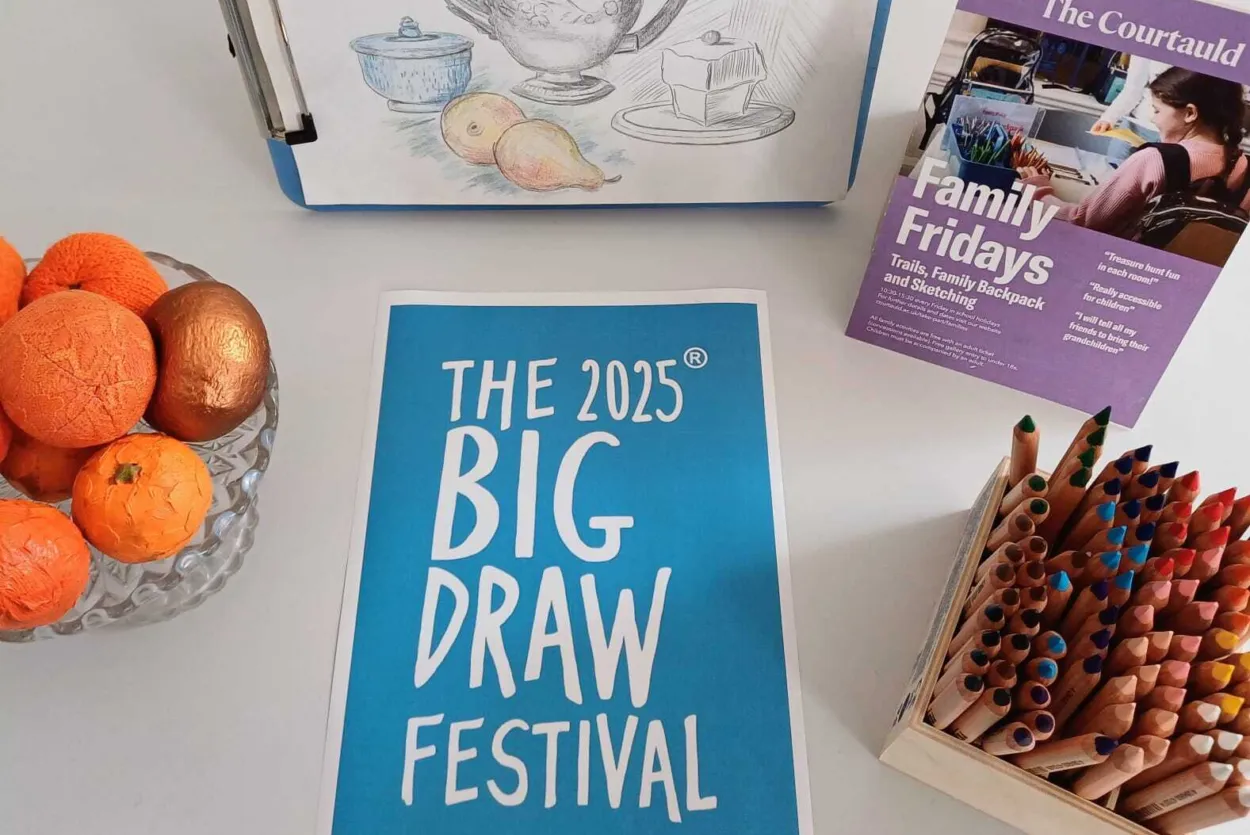 Image of still-life sketch, Big Draw poster, colouring pencils and satsumas