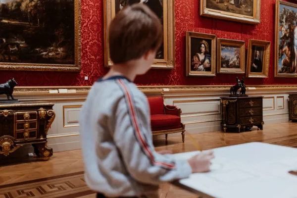 Boy drawing in the Great Gallery