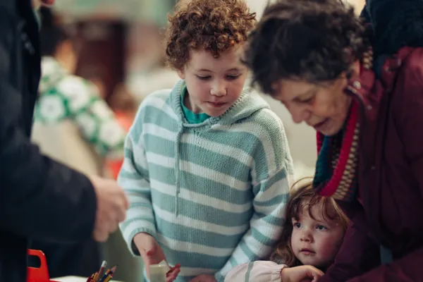 A family take part in a craft activity at The Box Plymouth