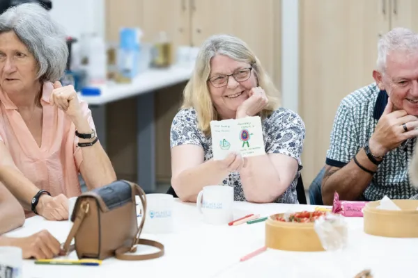 Group of people taking part in a drawing workshop