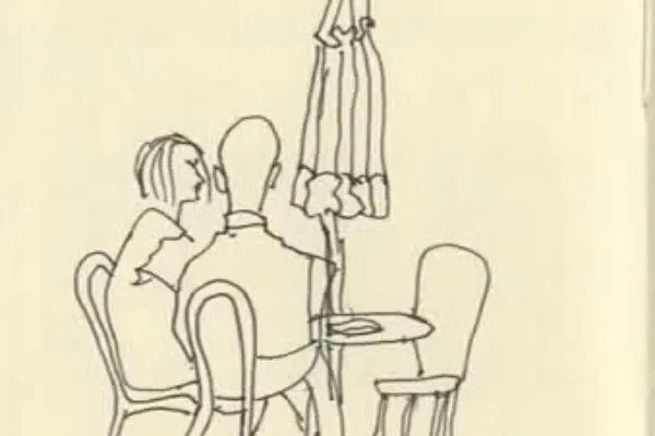 2 people at a cafe terrace table